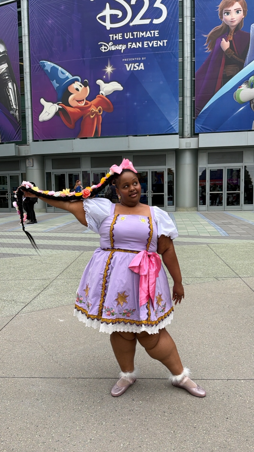 Lea wearing a Rapunzel-inspired outfit at D23