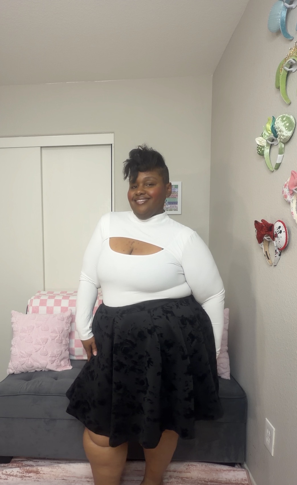 Lea in a white top and black skirt
